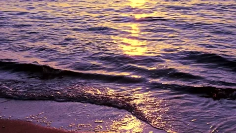Beach on baltic sea at sunset. Sparkling sea water. Ocean waves. Close up water. Stock Footage 155189933