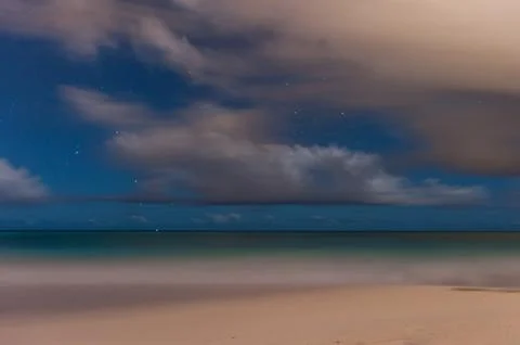 Beach in Barbados with extremely long exposure. Panning Stars in Background Stock Photos