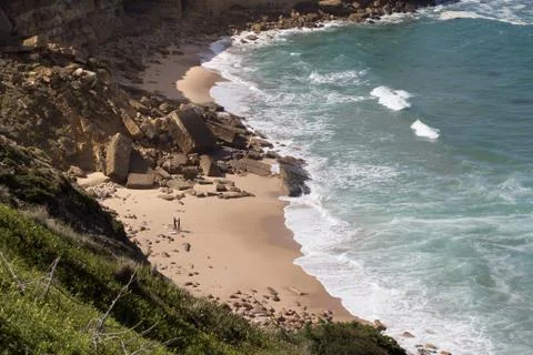 Beach bay with surfers Stock Photos