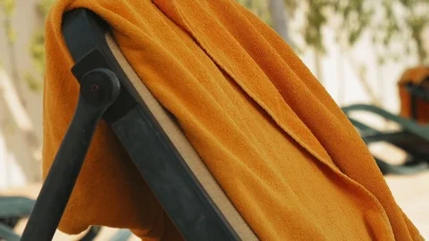 Beach bed with towel lying on it Stock Footage 82241176