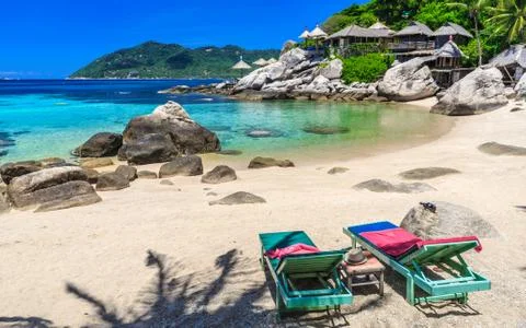 Beach bed on white sand beach at tropical island Stock Photos