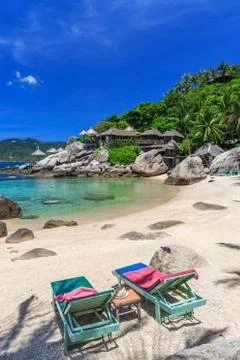 Beach bed on white sand beach at tropical island Stock Photos