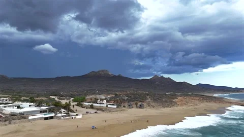Beach Below, Storm Beyond — A Cinematic Pull Out Over the Water Near La Laguna Stock Footage 340863324