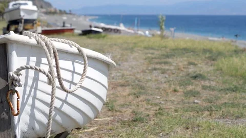 On the beach between boats on a summer day Stock Footage 121090716
