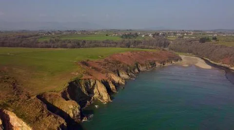 Beach between cliffs from drone over Stradbally Cove, Cooper Coast, Waterford Stock Photos