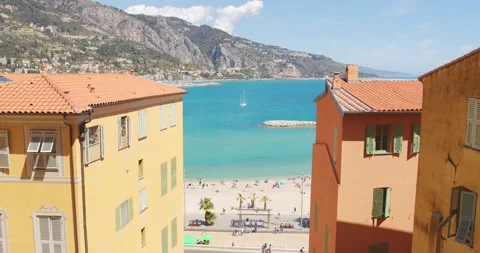 Beach between colorful old town houses, Menton, France Vídeo Stock 271574442