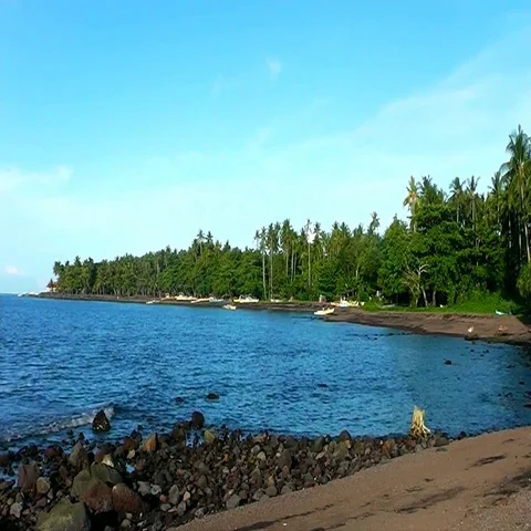 The beach of black sand and sunset. Camiguin Island. Philippines. 스톡 동영상 69434769