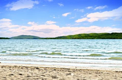 Beach with blue sky, Wave, view to sea Stock Photos