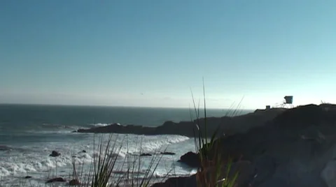 Beach with bluff and life guard tower wide shot Stock Footage 54294284