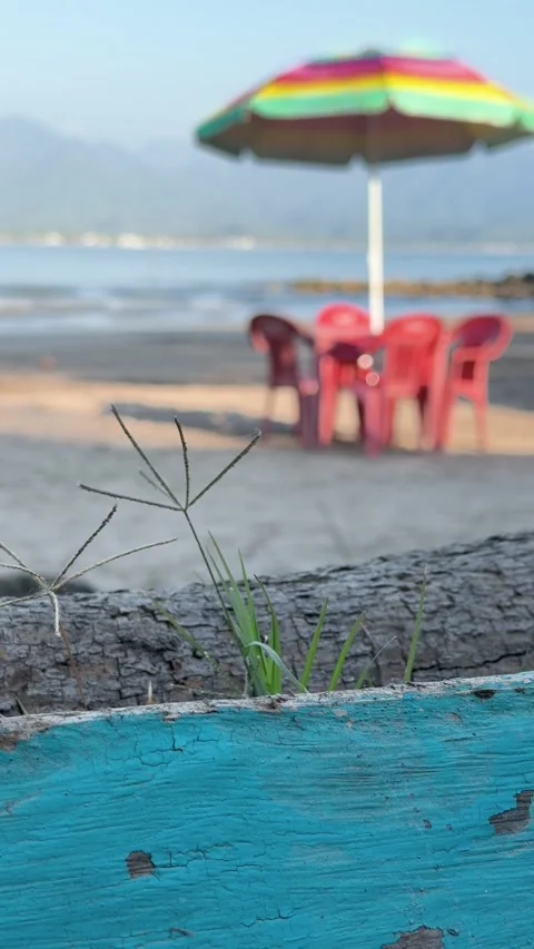 Beach blurred background with colorful umbrella and chairs Stock Footage 331002094