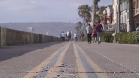 Beach Boardwalk with bicycle rolling through frame Video stock 94880712