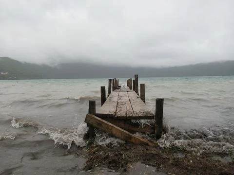 Beach boardwalk cloudy day Stock Photos