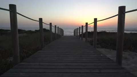 Beach boardwalk sunset brighter Video stock 163557159