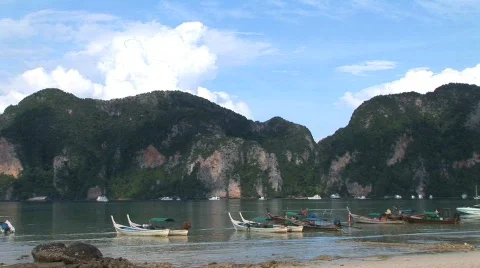 Beach with boats and limestone cliffs Stock Footage 295958