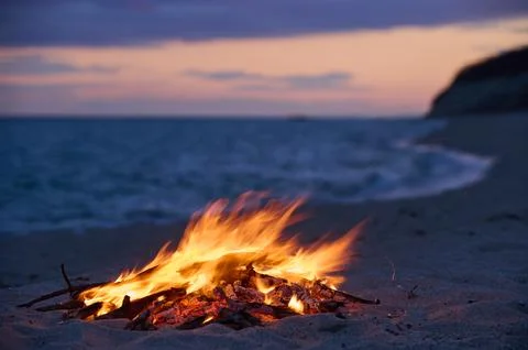 Beach Bonfire selective focus with Beautiful Sunset or sunrise nobody Stock Photos