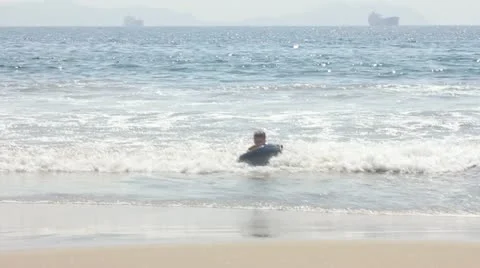 Beach boogie boarding Stock Footage 11629124