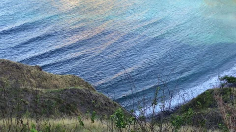 Beach at the bottom of a hill high angle view Stock Footage 276164436