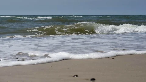 Beach with Breaking waves in slow motion Stock Footage 77218192