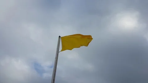 Beach caution yellow flag windy cloudy sky 스톡 동영상 102898689