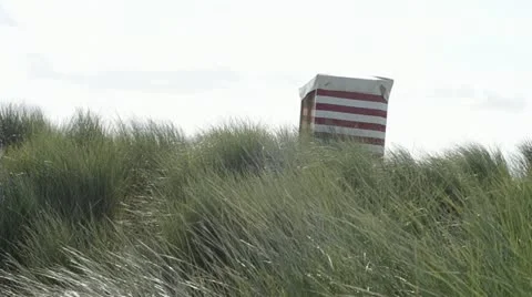 Beach chair on a dune Stock Footage 21650511