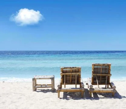 Beach chairs on beach Stock Photos