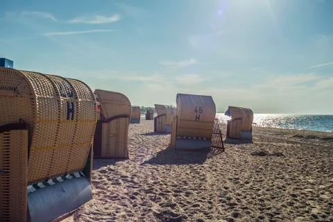 Beach chairs on the beach in the sunlight Stock Photos