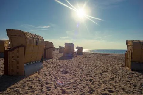 Beach chairs on the beach in the sunlight Stock Photos