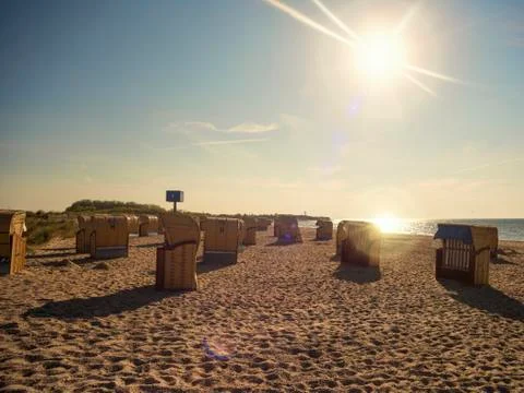 Beach chairs on the beach in the sunlight Stock Photos