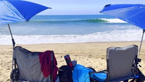 Beach Chairs, Blue Umbrella, Sandy Beach, Beach Waves Stock Footage 285474673
