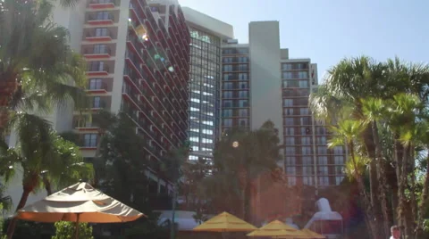 Beach Chairs in Front of Hotel Pool (Panning Down) Stock Footage 58337854