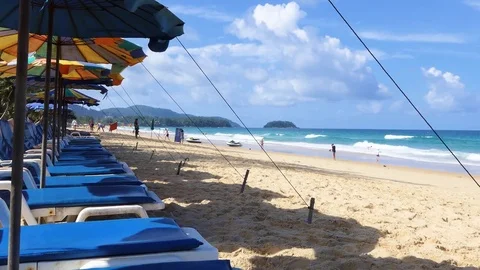 Beach chairs placed in a row at the beautiful Karon Beach, Phuket, Thailand. Stock-Footage 79257680