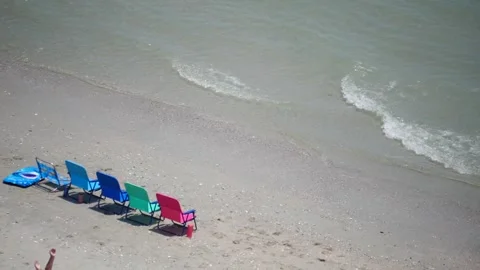 Beach Chairs on Sandy Shore Stock-Footage 262396988