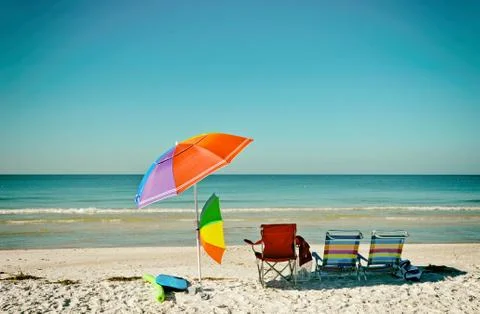 Beach Chairs with Umbrellas Stock Photos