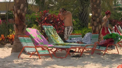 Beach Chairs Under Palm Trees at Waterpark Video stock 31985696