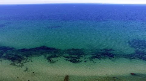 Beach with clear blue waters - Aerial view -  birds eye view Stock Footage 62927550