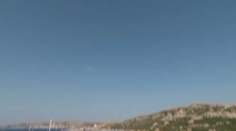Beach with clear sand and docked boat Stock Footage 37090643