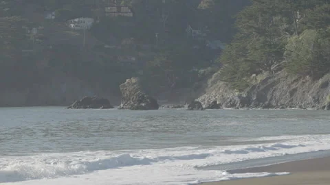 Beach with cliff middle ground and hill background, San Francisco Stock Footage 333194145