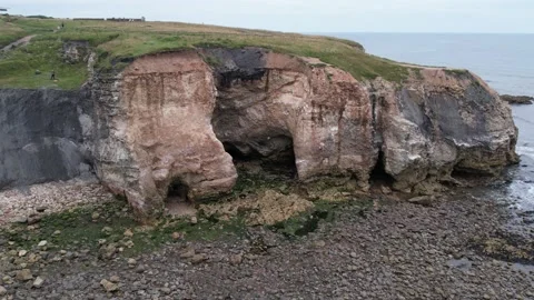 Beach cliff reveal shot Stock Footage 237785238