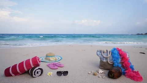 Beach clothes on the sand in front of the sea Stock Footage 101659479