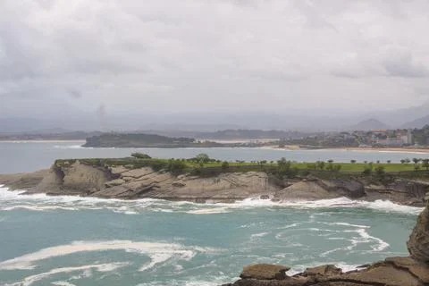 Beach on a cloudy day Stock Photos