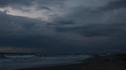 Beach on a cloudy evening, thunderstorm in the background Video stock 33199266