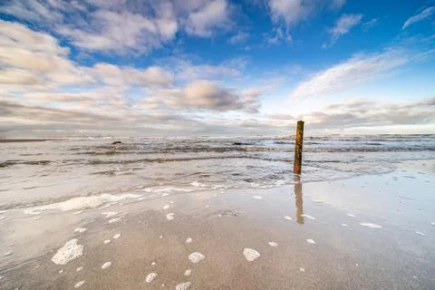The beach, the cloudy sky and the shore lin Stock Photos