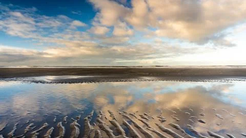 The beach, the cloudy sky and the shore lin Stock Photos