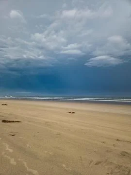 Beach with Cloudy Sky Stock Photos