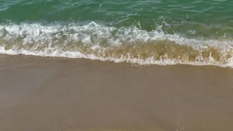 Beach coast gentle waves. Close up beach sea waves. Ocean waves on beach. Stock Footage 139669359