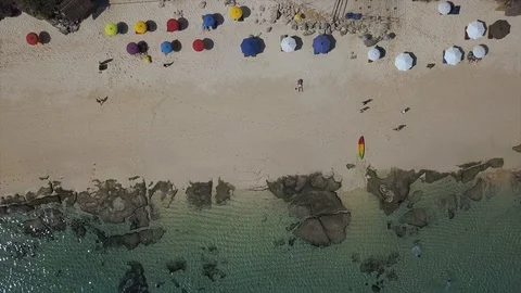 Beach with colored umbrellas top view Stock Footage 99396689