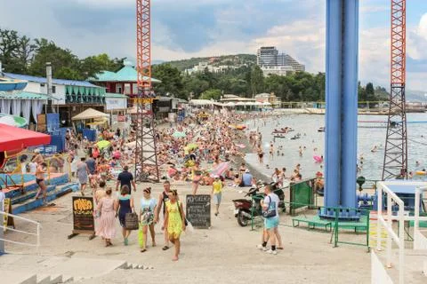The beach is crowded with people. Stock Photos
