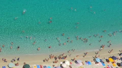 Beach with crystal clear waters full of people- Tropea, Italy 動画素材 67809750