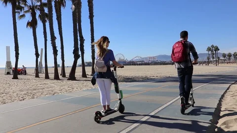 Beach cycle path between Venice Beach and Santa Monica Pier Stock Footage 129900135