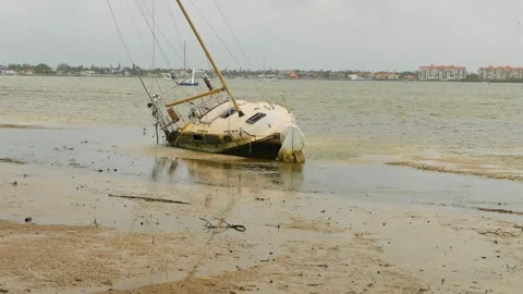 Beach damaged storm surge  after hurricanes Helene and Milton at Gulfport Beach Stock Footage 291415477